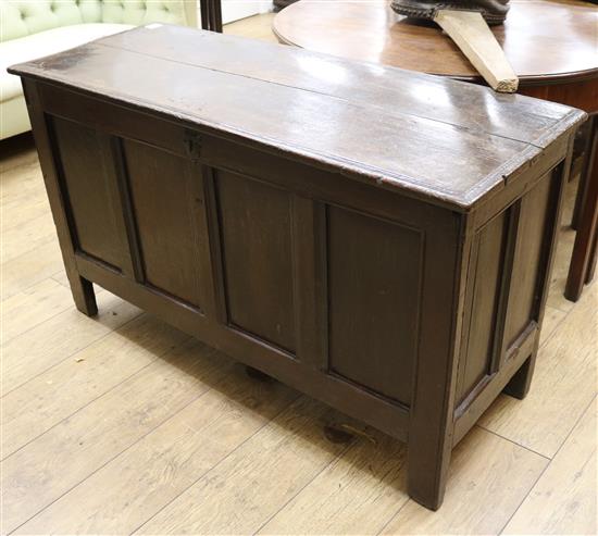 An oak panelled coffer, 4ft 2in.